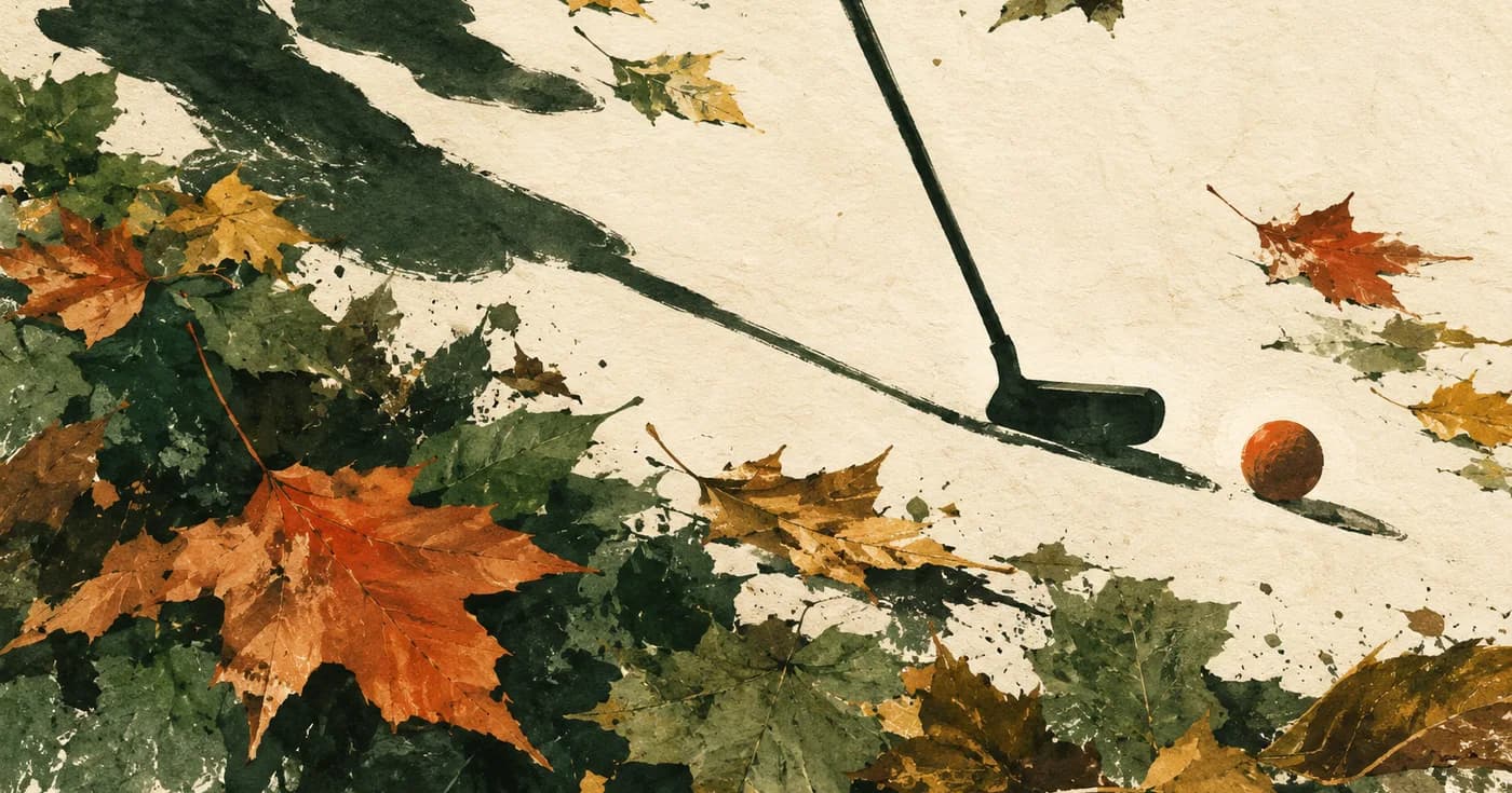 a putter shadow reaching across a page of autumn leaves