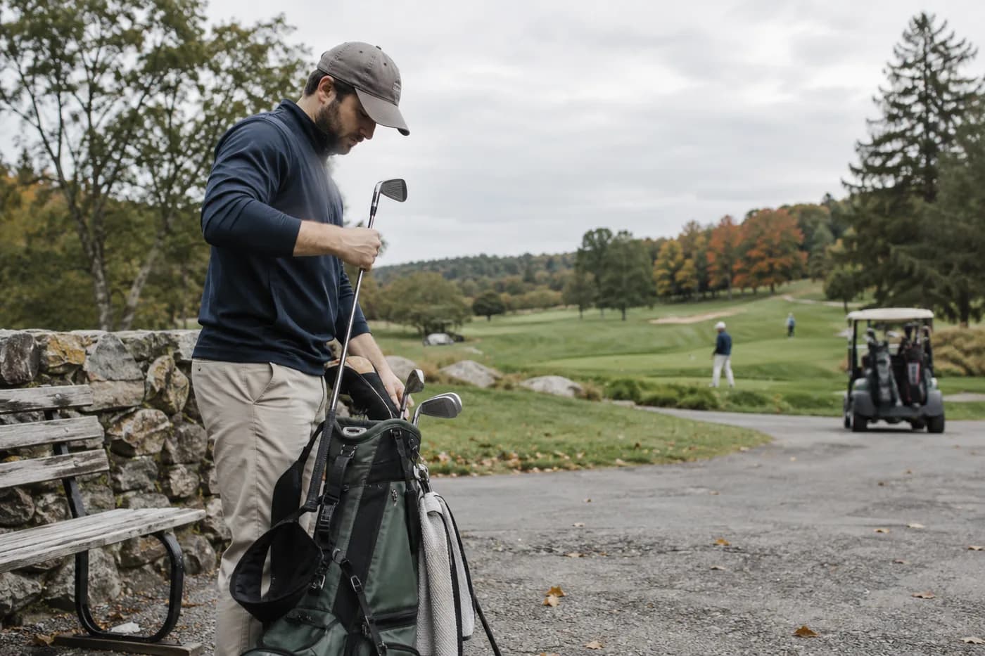 a golfer with a half set of clubs preparing for a short weekday round